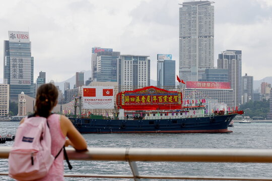 A fishing vessel with Chinese and Hong Kong flags sails to celebrate the 24th anniversary of the former British colony's return to Chinese rule, on the 100th founding anniversary of the Communist Party of China, in Hong Kong