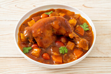 chicken stew with tomatoes, onions, carrot and potatoes