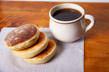 Clotted cream biscuits and cup of coffee. Sweet gorditas. Traditional mexican recipe