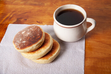 Clotted cream biscuits and cup of coffee. Sweet gorditas. Traditional mexican recipe