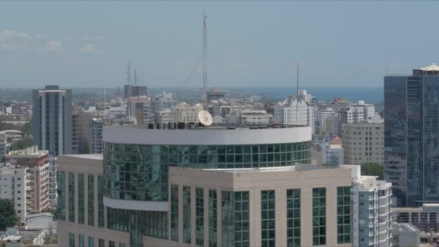 Santo Domingo, Skyscraper With Reflecting Glass And Cityscape, Dominican Republic, Aerial