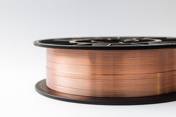 Welding wire spool on a white background.