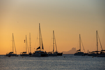 Yachts in Cala Saona Beach in Formentera in Spain in summer 2021.