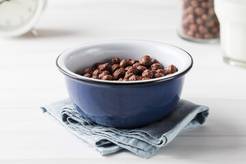 Round cocoa flakes in a bowl. Dry breakfast.