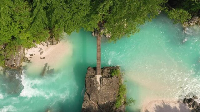 Aerial &ndash; Beautiful Soča river with a hanging bridge over it and a majestic water