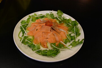 fresh colourful asian vegetables salad lo hei yu sheng with smoked salmon and sauces buffet for chinese new year menu