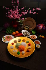 fresh colourful asian vegetables salad lo hei yu sheng with smoked salmon and sauces buffet for chinese new year menu