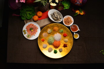 fresh colourful asian vegetables salad lo hei yu sheng with smoked salmon and sauces buffet for chinese new year menu