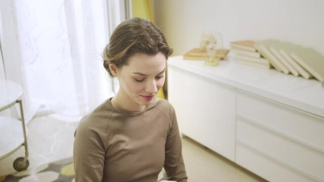 A young lady is looking at something on the phone 