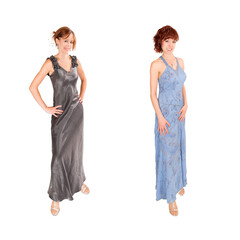 Beautiful young woman wearing two elegant evening dresses, isolated in front of white studio background