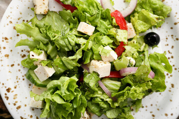 Plate with fresh Greek salad, closeup