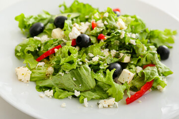 Plate with fresh Greek salad, closeup