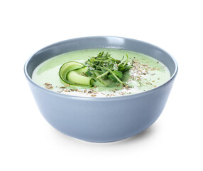 Bowl with green gazpacho on white background
