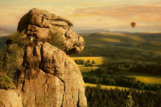 Ape is most famous rock formation in Table Mountains, Stolowe Mountains in Poland with baloon. 
View from Great Szczeliniec, Szczeliniec Wielki highest peak of Stolowe Mountains to Czech