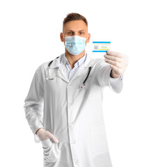 Male doctor with vaccination card on white background