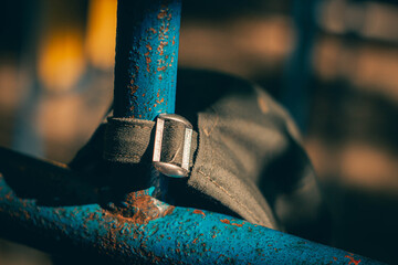 baseball cap hanging on a hook 