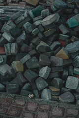 many bricks and stones lie on the ground 