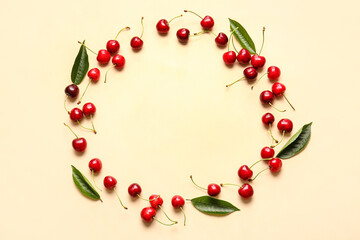 Frame made of tasty ripe cherry on color background