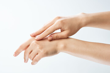 female hands skin care moisturizing medicine close-up