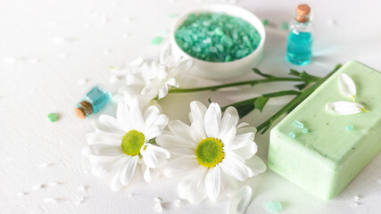 cosmetics and soap made from natural ingredients, flowers on a white background close up