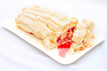 Raspberry Roulade Meringue Dessert on a plate with copy space and natural light