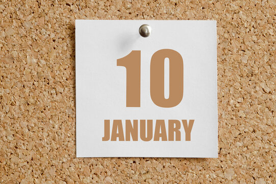 january 10. 10th day of the month, calendar date.White calendar sheet attached to brown cork board.Winter month, day of the year concept