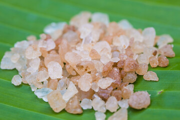 Pink Himalayan Salt on Green Leaf Background