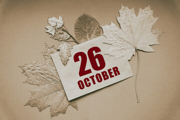 october 26. 26th day of month, calendar date.Envelope with the date and month, surrounded by autumn...