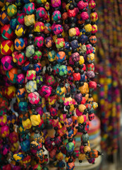 Colorful Mexican souvenirs (beads) sold at a market in San Miguel de Allende, Mexico. 2021.