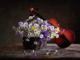 Still life with bouquet of wildflowers and violin