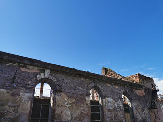 The ruins of the cathedral of the monastery of the Black Brothers in the city of Vyborg against the blue sky.