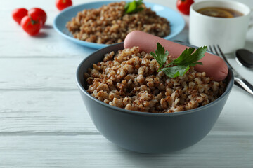 Concept of tasty eating with buckwheat on wooden table