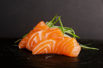 traditional sashimi sushi over black background