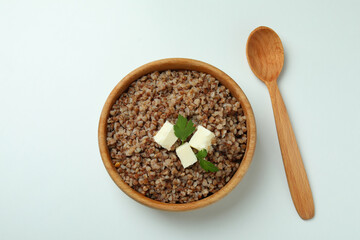 Concept of tasty eating with buckwheat on white background