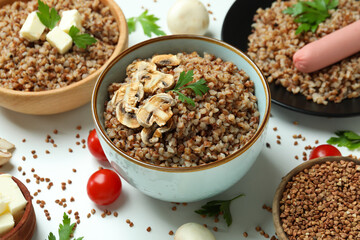 Concept of tasty eating with buckwheat on white background