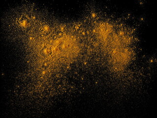 Turmeric (Curcuma) powder pile isolated on black background, top view