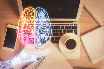 Double exposure of brain drawing hologram over topview work table background with computer. Concept of big data.