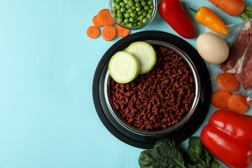 Concept of organic pet food on blue background