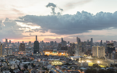 Fototapeta premium Bangkok, thailand - Jun 19, 2021 : Bangkok downtown cityscape in Business district with bright glowing lights at night give the city a modern style. Selective focus