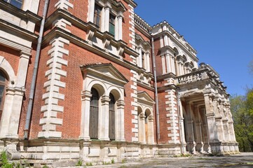 An ancient building. Manor house of a noble estate made of red bricks with white trim. The main house of the Bykovo estate. 