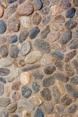 Texture background from granite paving stones. Cemented stones. Vertical image.