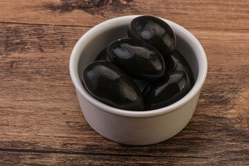 Pickled black olives in the bowl