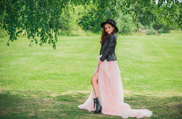 Tender elegant young bride in pink pastel wedding dress, fashionable fancy collection