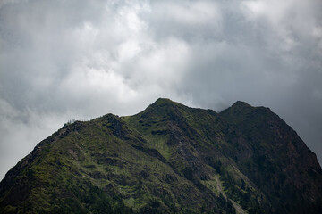 Fototapeta premium Background clouds over the mountains folk style.
