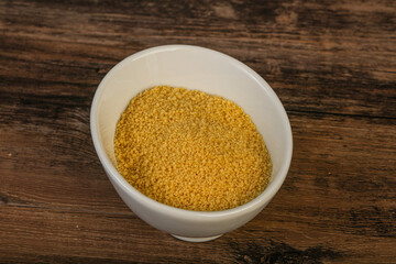 Raw cous cous heap in the bowl