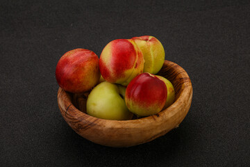 Sweet small nectarines in the basket