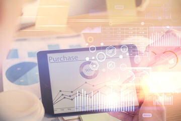 Multi exposure of man's hands holding and using a digital device and data theme drawing. Innovation concept.