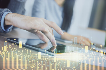 Double exposure of data theme hologram drawing and man and woman working together holding and using a mobile device.