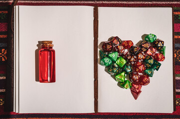 Overhead image of a bottle and rpg dice creating I love