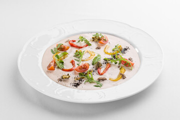 Vitello tonnato traditional italian dish on white plate isolated on white background